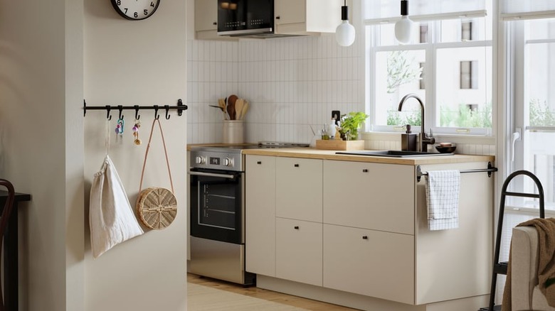 Beige and white kitchen with Ikea storage solutions