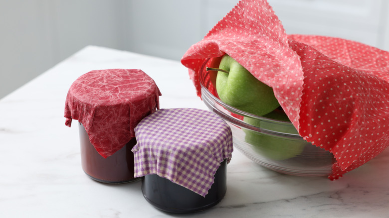 Bowls and cups covered with beeswax food wrap
