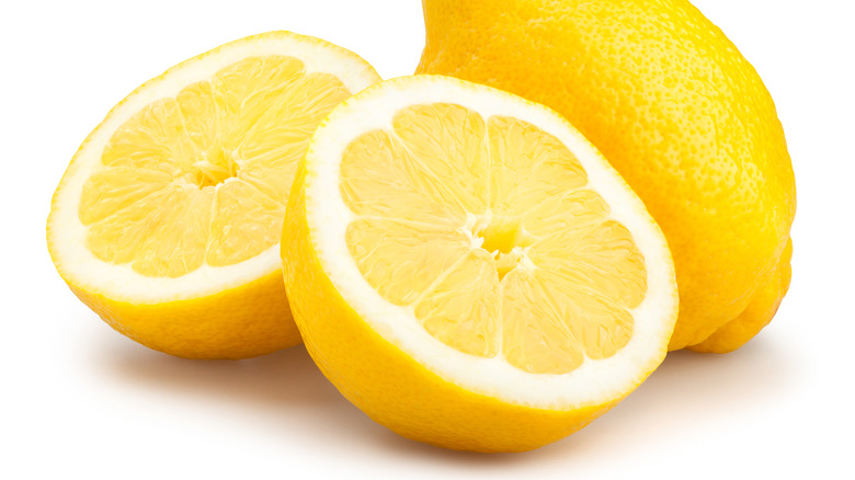 Lemon halves on white background