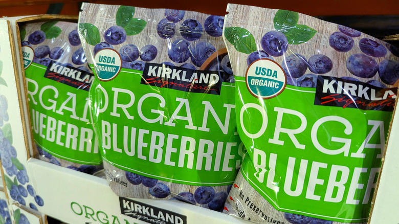 Three bags of organic blueberries on Costco shelf