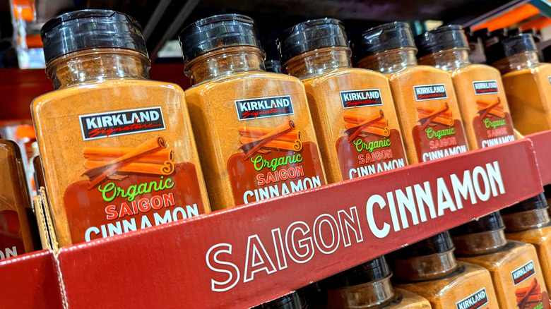 Plastic containers of cinnamon on Costco shelves