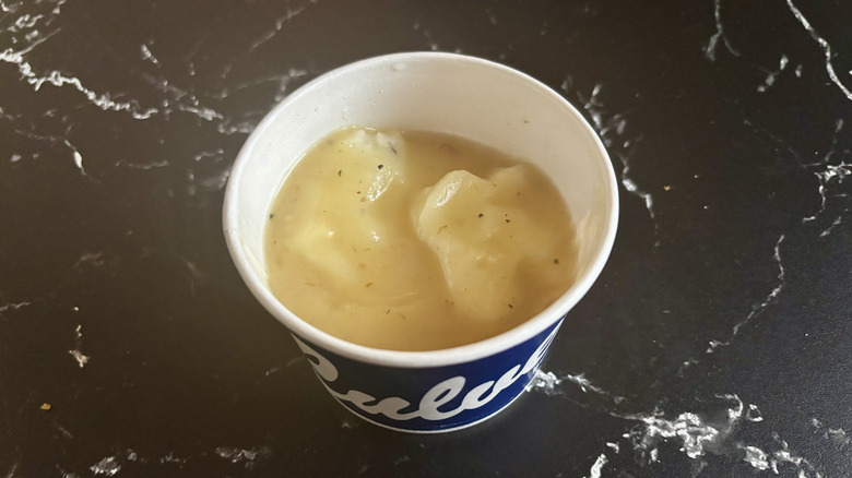 Cup of mashed potatoes with gravy