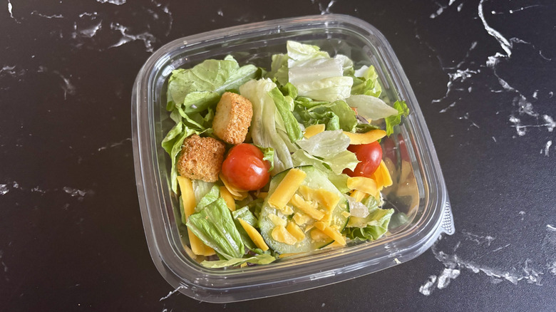 Garden side salad in plastic container