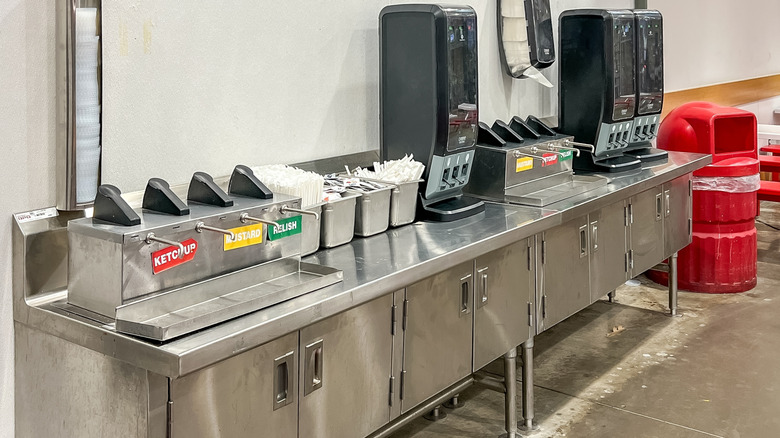 Costco condiment stations with steel tables