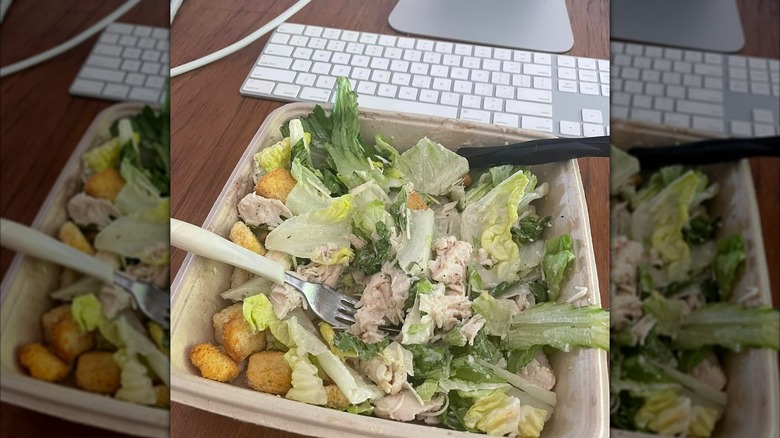 Caesar salad in a takeaway container