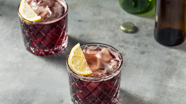 Boozy Kalimotxo Red Wine and Cola with a Lemon Garnish