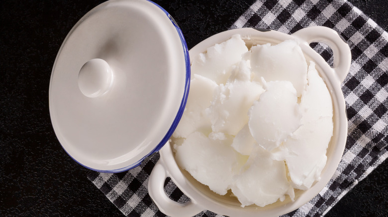 Scoop of lard in a ceramic pot