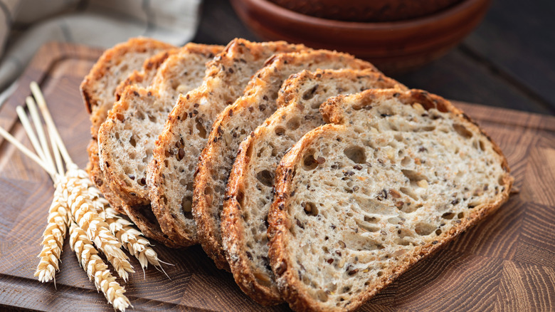 sliced seeded bread on cutting board