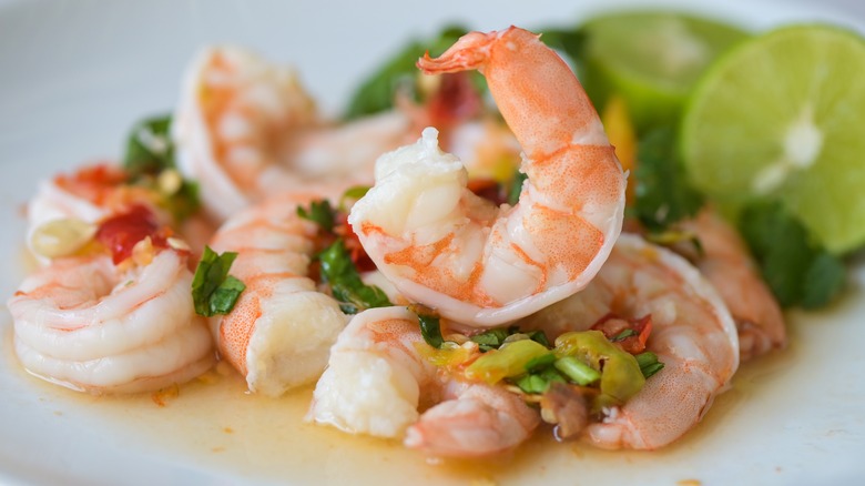 Cooked shrimp tails with lime