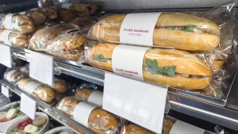 Prepackaged sandwiches on grocery fridge shelf