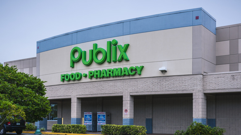 Exterior of a Publix supermarket and pharmacy against overcast sky