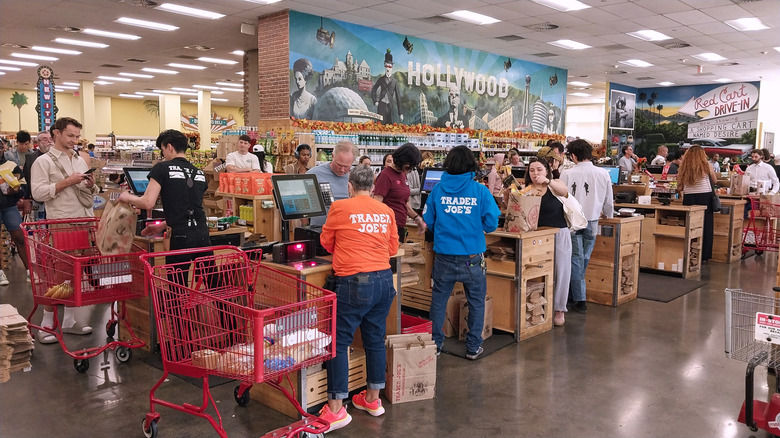 Interior of Trader Joe's grocery showing busy checkout lanes