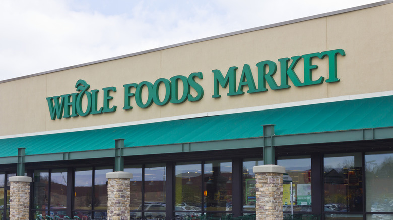 exterior of a Whole Foods Market against pale sky
