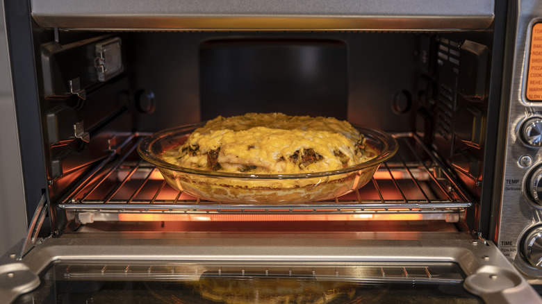 Food in glass dish in toaster oven