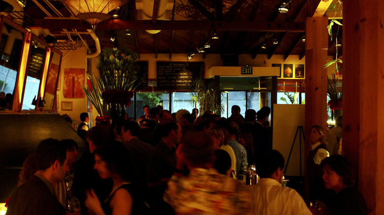 people mingling inside Chaya Brasserie