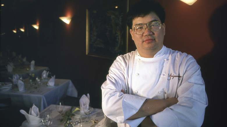 Chef Yujean Kang stands in his restaurant in 1999