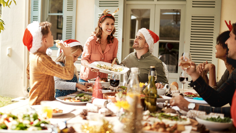Family sitting down for Christmas brunch