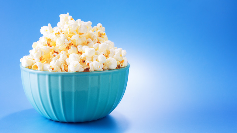 bowl of popcorn on blue backdrop