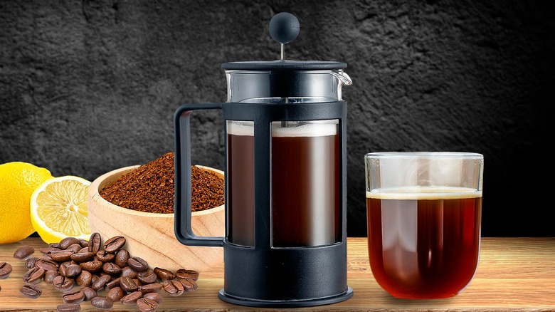 French press with coffee cup