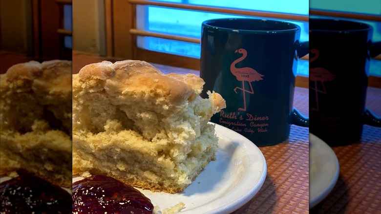 Fluffy biscuit with jam and a Ruth's Diner mug