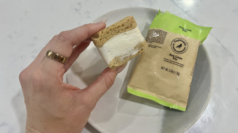 Hand holding chomps size Key Lime Pie Nightingale ice cream sandwich.