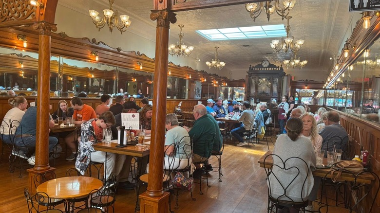 Interior of ice cream parlor with people at tables
