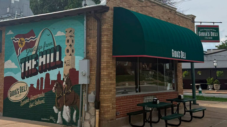 Gioia's Deli sandwich shop, with green picnic-style tables out front.