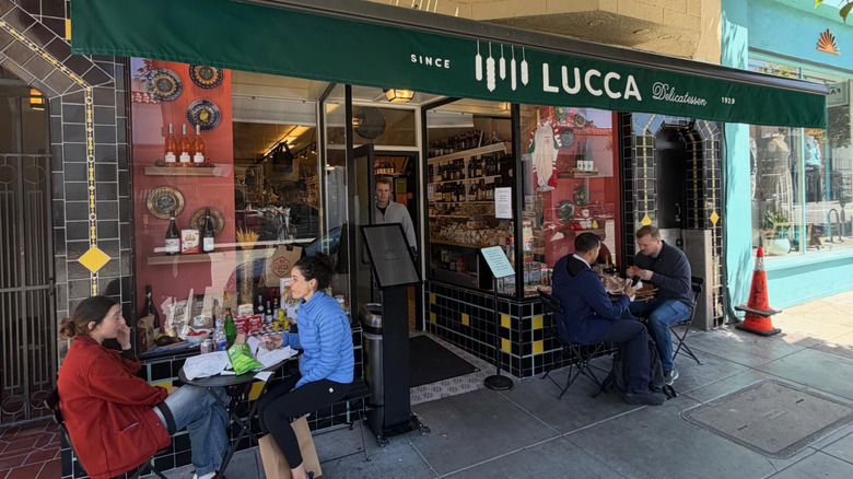People seated outside Lucca restaurant.