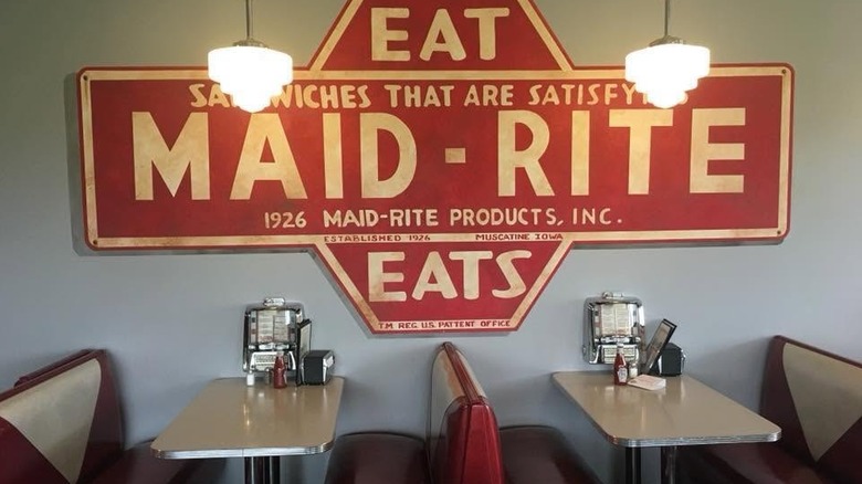 A maroon Maid-Rite with old-school red and white diner booths.