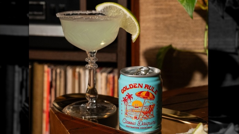 A can of Golden Rule Daiquiri next to a prepared glass.