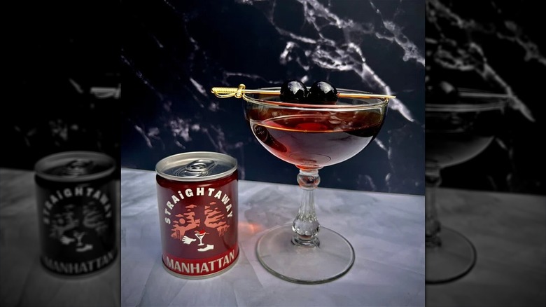 A Straightaway Manhattan can next to a prepared glass.