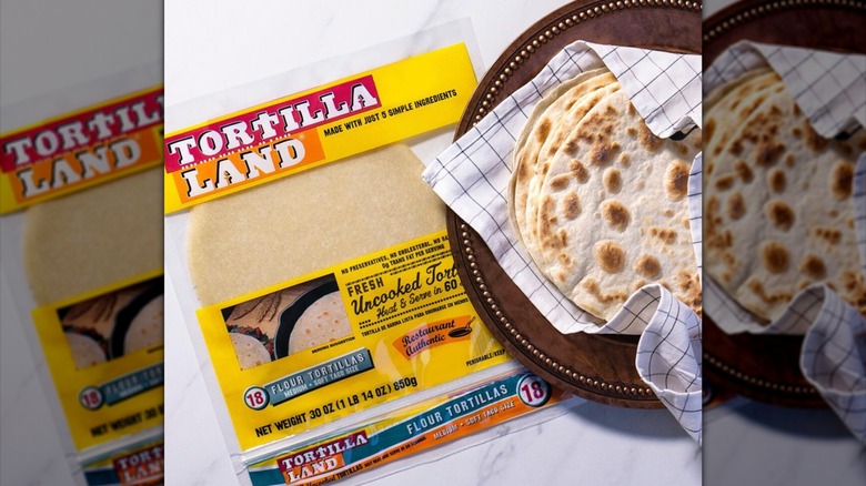 fresh tortillas in a linen next to a Tortilla Land package