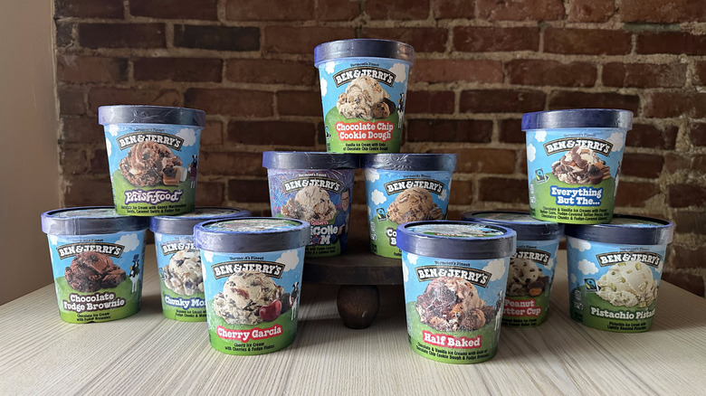Pints of Ben and Jerry's ice cream on wooden table
