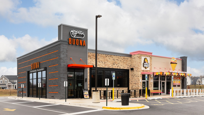 The outside of a modern Buona Beef restaurant that shares a building with a Rainbow Cone ice cream shop.