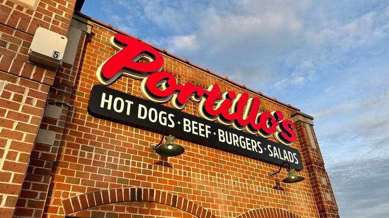 The red lettering on the side of a Portillo's restaurant.