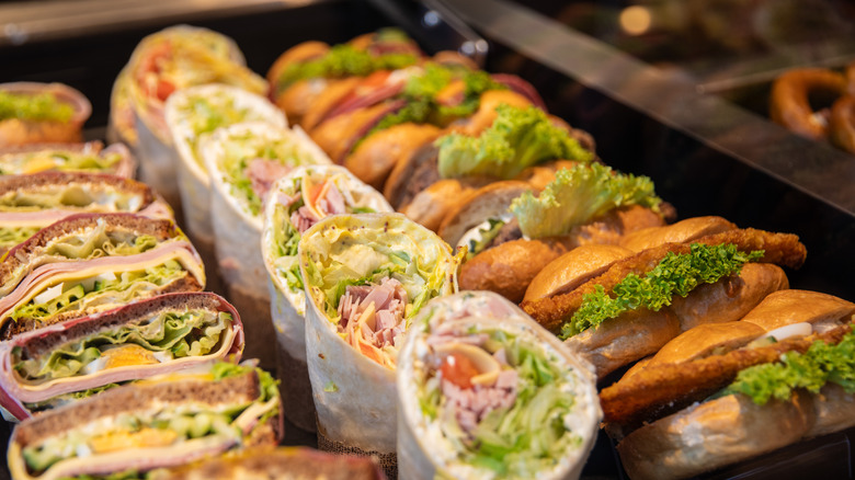 A variety of sandwiches and wraps set out for display