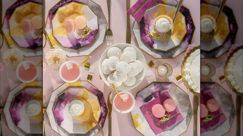 A beautiful pink and purple tablescape featuring Coterie Roar+Rabbit Watercolor Plates
