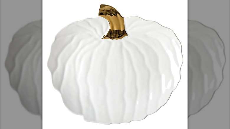 White pumpkin-shaped plate with a golden stem