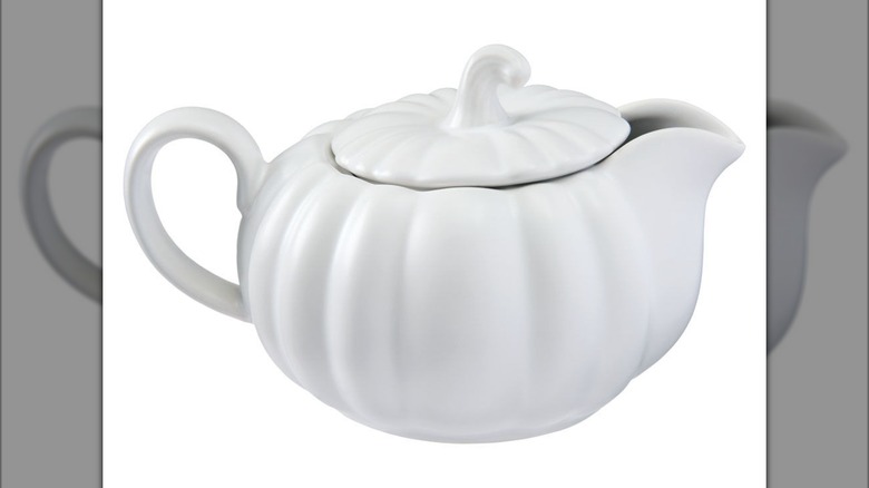 White pumpkin-shaped gravy boat with a lid