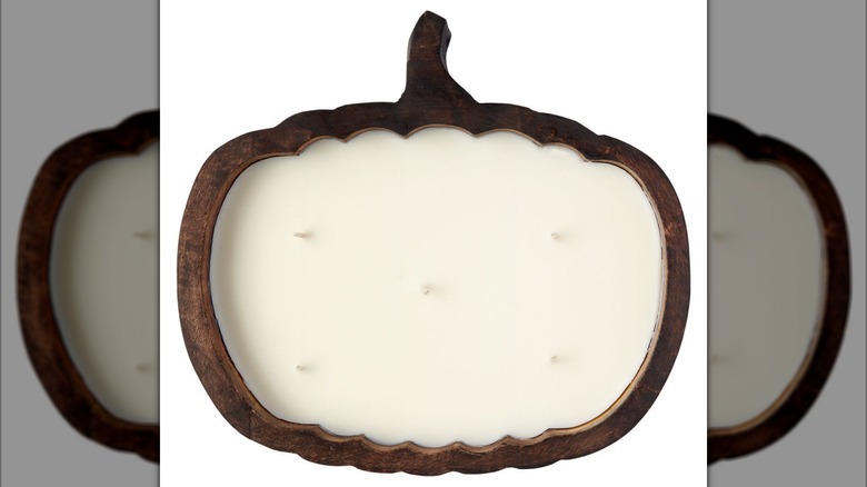 Large, wooden, pumpkin-shaped candle with five wicks