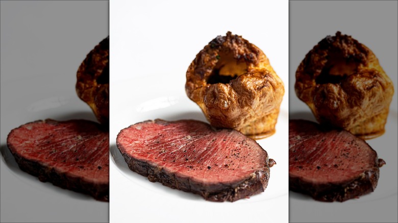 The Savoy Grill's Sunday roast served with a Yorkshire pudding on a white background