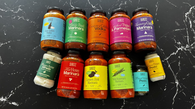 Various Sauz jarred pasta sauces on countertop