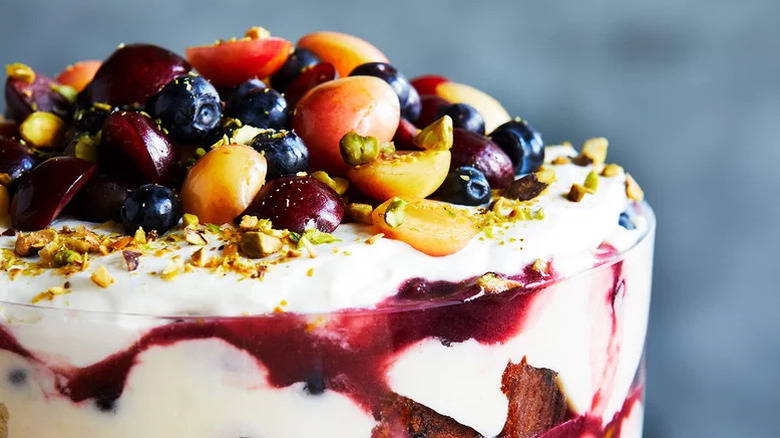 Cherry-Pistachio Trifle topped with fruit and nuts