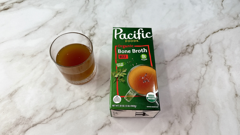 Pacific beef bone broth and glass of broth