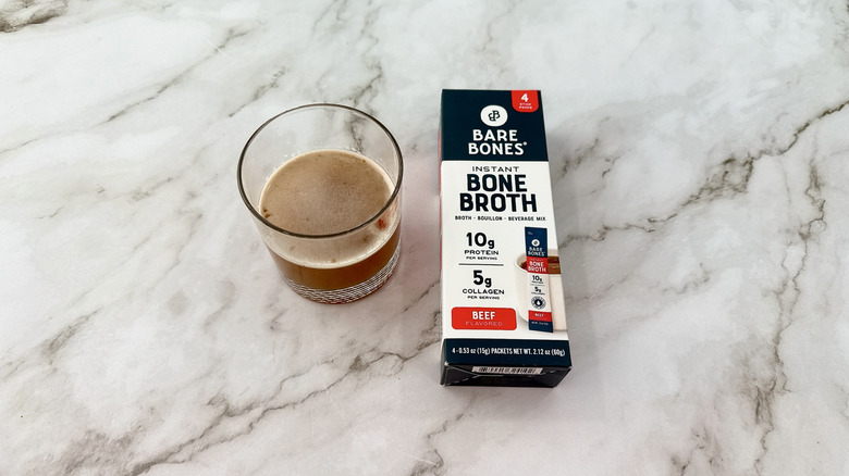 Bare Bones beef bone broth and glass of broth