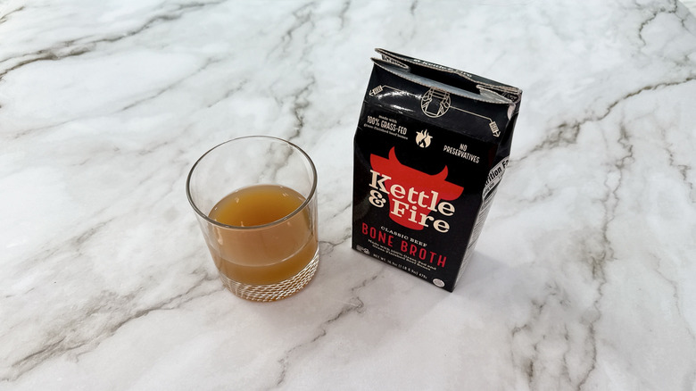 Kettle & Fire beef bone broth and glass of broth