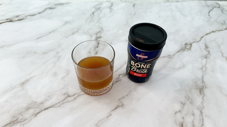 Swanson beef bone broth and glass of broth