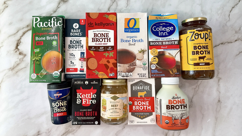 11 brands of beef bone broths on a marble counter