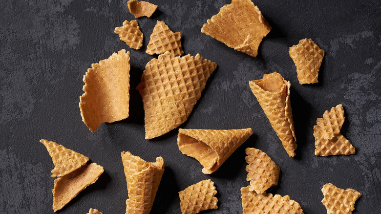 Pieces of ice cream cones on a dark gray backdrop