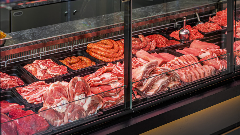 A butcher case display with a variety of meat